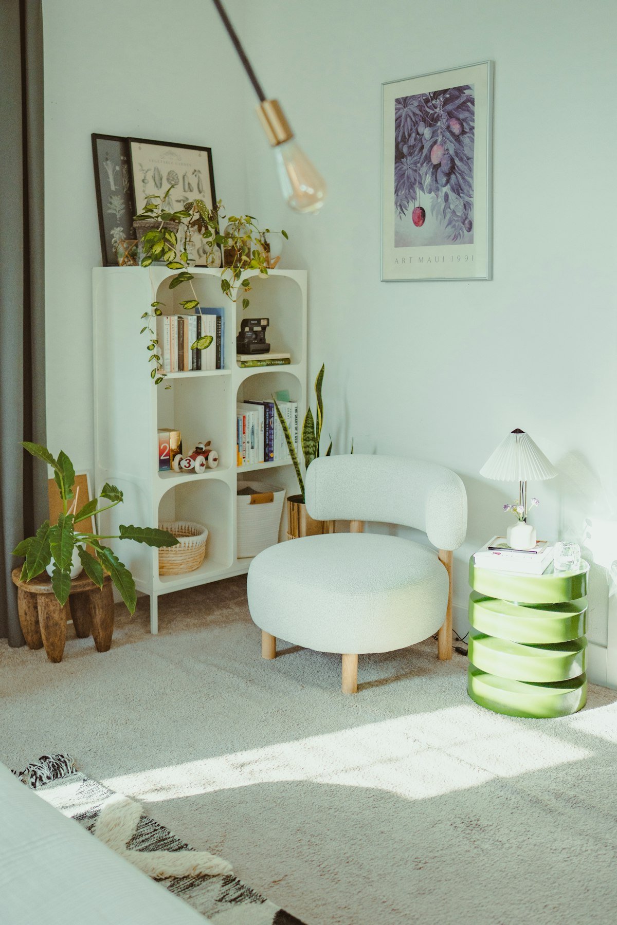 Bright reading corner with small plants on shelves, showing balanced plant decor and negative space